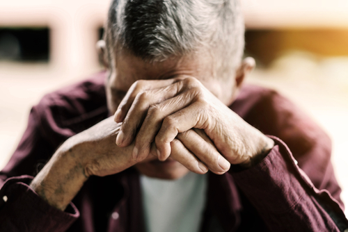 Senior,Man,Covering,His,Face,With,His,Hands.vintage,Tone